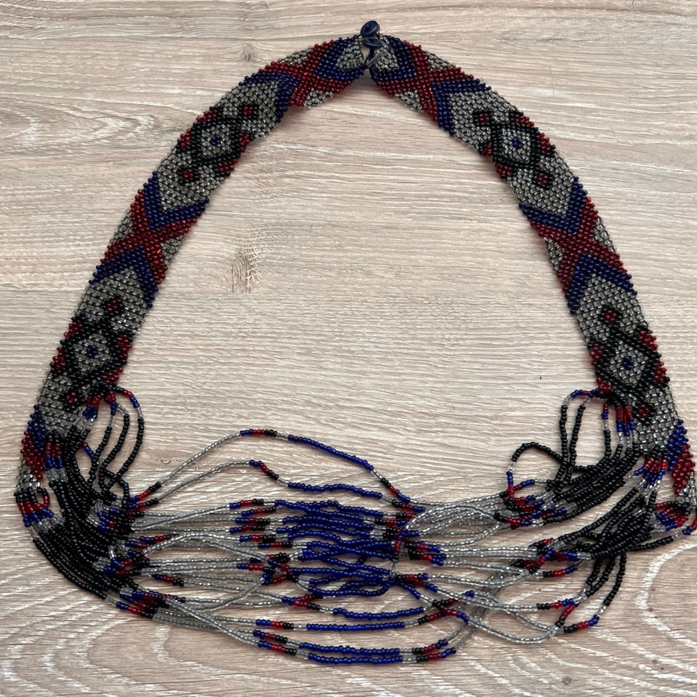 Artistic Blue and Red Necklace with Metallic Accents